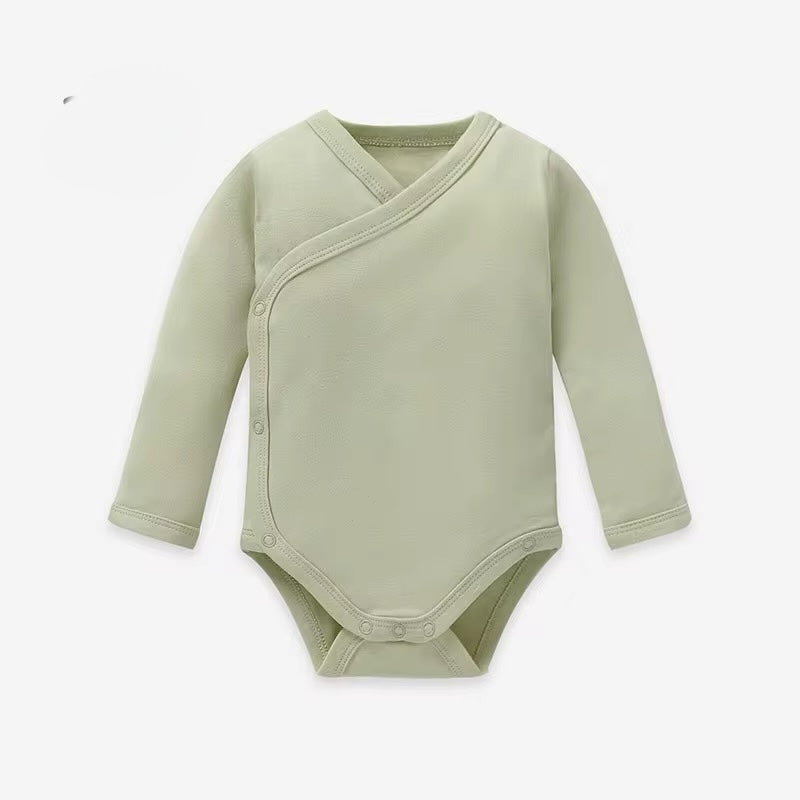 Green baby bodysuit with long sleeves on a white background