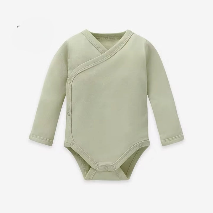 Green baby bodysuit with long sleeves on a white background