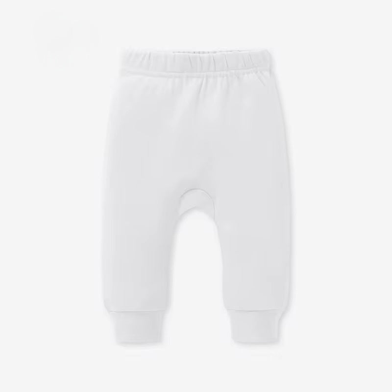 White baby pants on a light gray background