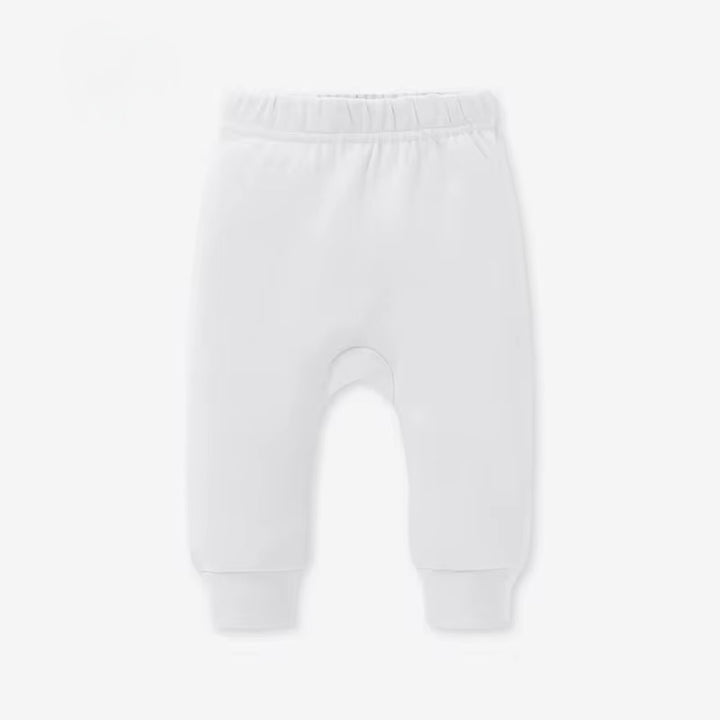 White baby pants on a light gray background