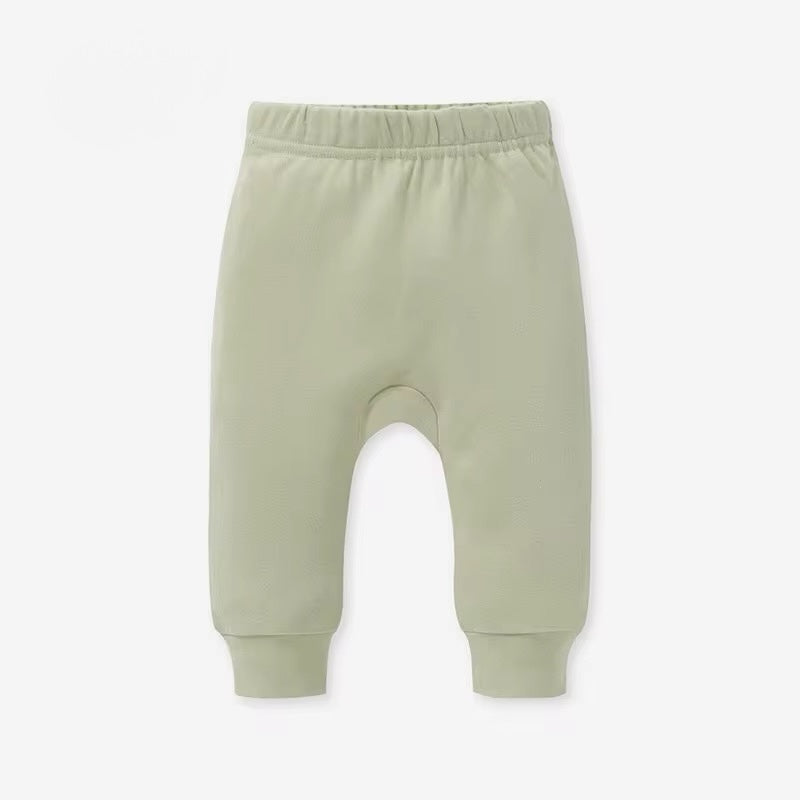 Light green baby pants on a white background