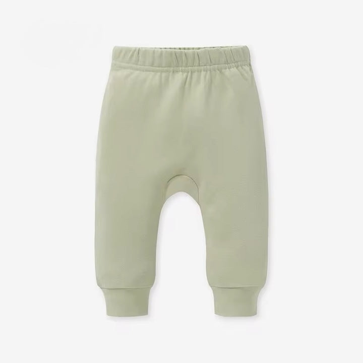 Light green baby pants on a white background